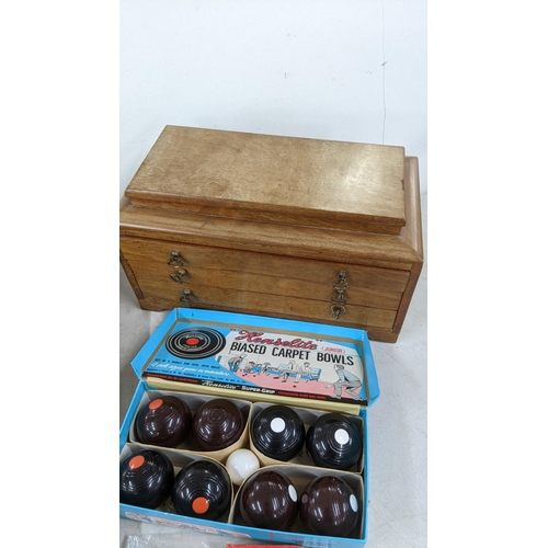 96 - A mixed lot to include Le Creuset cooking pot, a vintage bagatelle board and balls, carpet bowls and... 