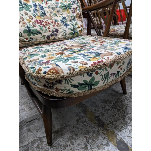 245 - Two Ercol fleur-de-Lys open armchairs with tapestry printed style loose seat and back cushions
Locat... 