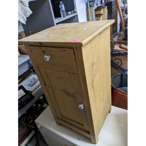 250 - A pine pot cupboard with white porcelain handles on block feet 77 x 42.5 x 39cms
Location:G