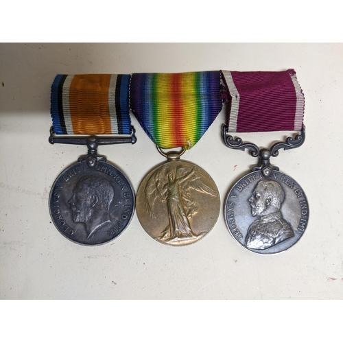 329 - A WWI long service and good conduct three-medal campaign group with ribbons on bar named to M-31523 ... 