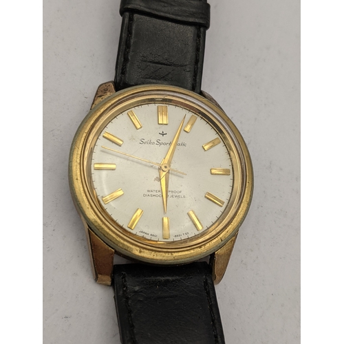 12 - A vintage automatic gold plated Seiko sportsmatic having  both hour markers, central seconds and in ... 