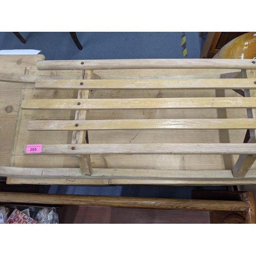 205 - A modern wooden sledge with a planked seat and metal runners
Location:LWM