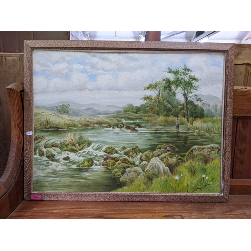 209 - Two pictures comprising of a river scene with a figure fishing oil on board signed L Cooper - dated ... 