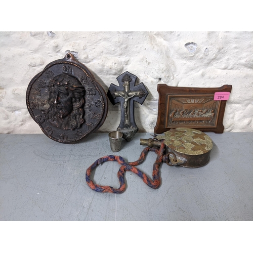 284 - Religious artefacts to include a Corpus Christie and cup, a plaque of Jesus and the last supper
Loca... 