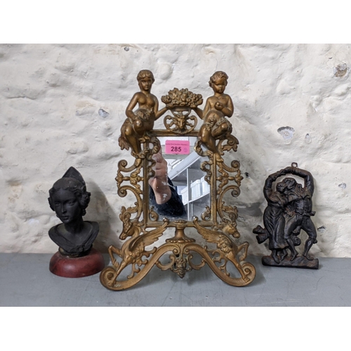 285 - Mixed 19th Century and later collectables to include a cast iron picture frame, a figure plaque and ... 