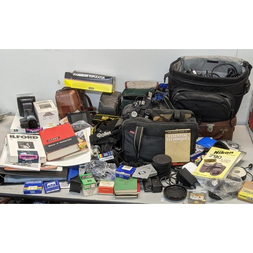 308 - Mixed photographic equipment to include a Nikon Finepix camera, camera carry bags, camera straps, op... 