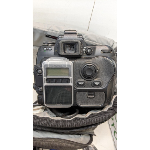 308 - Mixed photographic equipment to include a Nikon Finepix camera, camera carry bags, camera straps, op... 