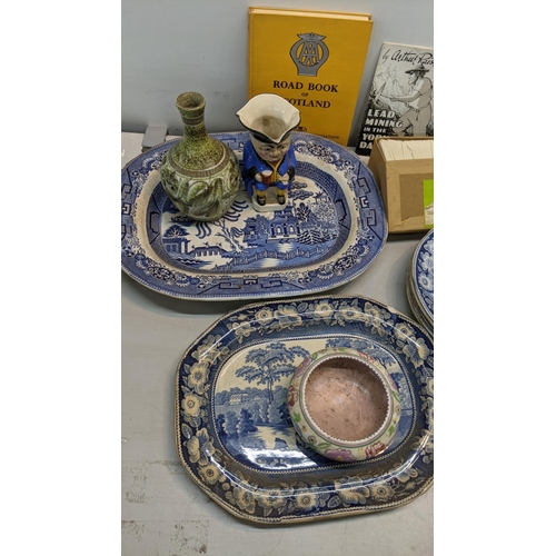 310 - A mixed lot to include blue and white dinner plates and platters together with a collection of mixed... 