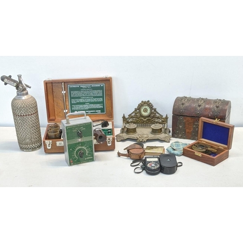 313 - A mixed lot to include a 19th century ink well stand with a clock, along with a Weston master exposu... 