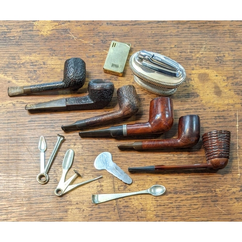 315 - A Group of vintage smoking pipes to include a falcon pipe and others along with a table top lighter ... 