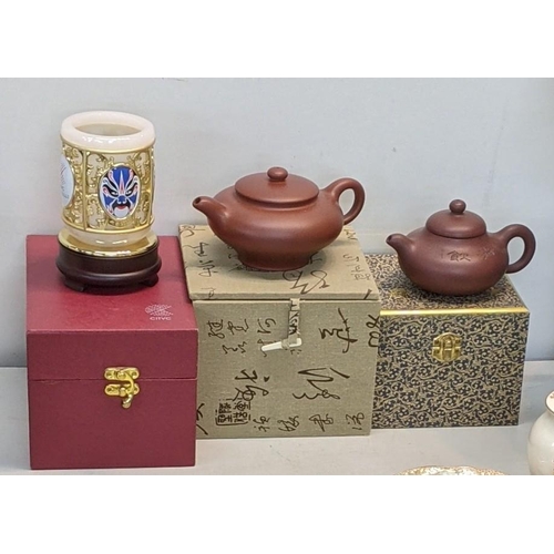 323 - Two Yixing terracotta tea pots together with one other item
Location:RWM