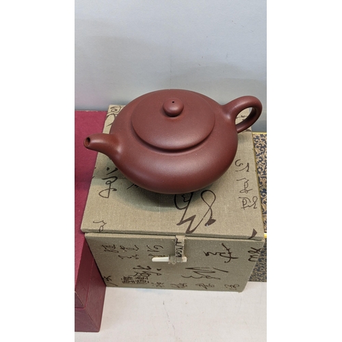 323 - Two Yixing terracotta tea pots together with one other item
Location:RWM