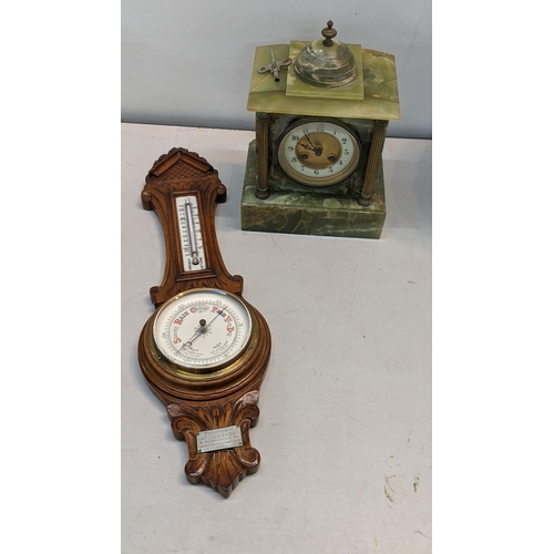 324 - A Green onyx marble mantle clock together with a barometer
Location:BWR