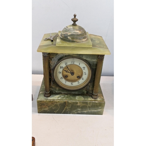 324 - A Green onyx marble mantle clock together with a barometer
Location:BWR