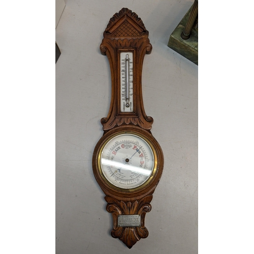 324 - A Green onyx marble mantle clock together with a barometer
Location:BWR