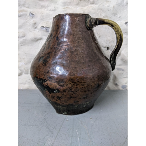 410 - An 18th century Western Asian copper and brass jug
Location: LWB