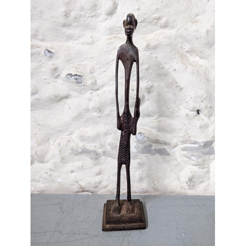 416 - An African bronze elongated figure of a man with a club in his hand
Location: RWB