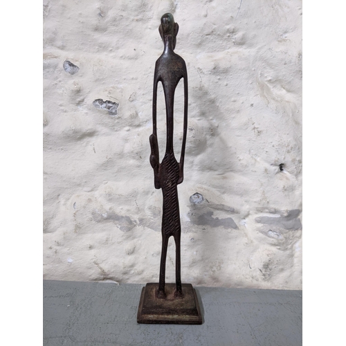 416 - An African bronze elongated figure of a man with a club in his hand
Location: RWB