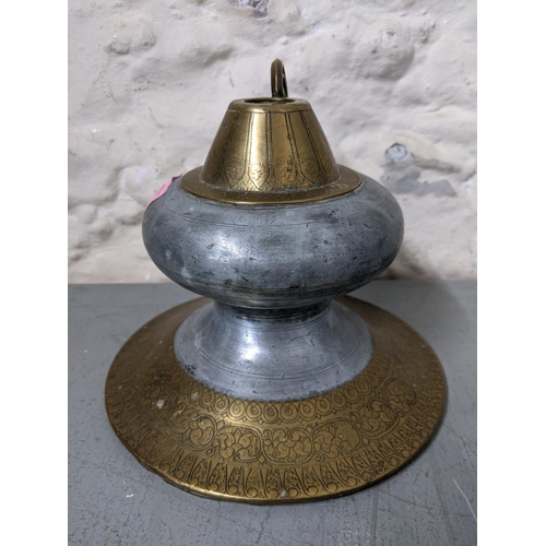 435 - A 19th century Islamic brass and pewter hookah pot
Location: LWM