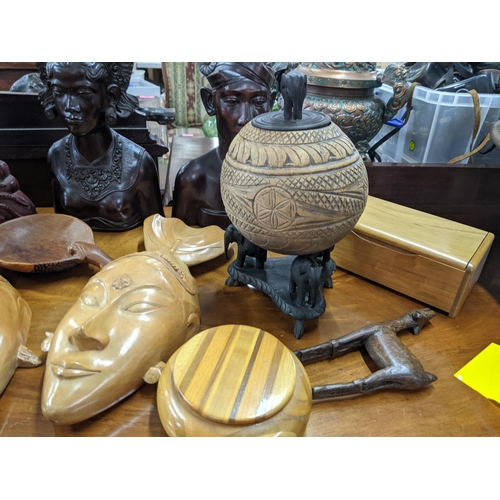 445 - A group of treen items to include African busts, boxes and masks and other items
Location: A2B