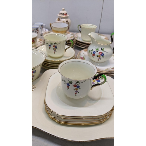 453 - A mixed lot of ceramics to include a Royal Crown Derby cup and saucer, a set of five coffee cups and... 