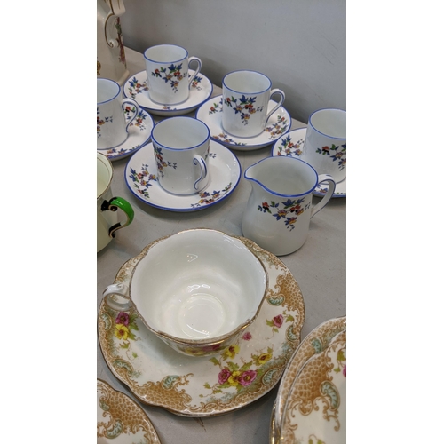 453 - A mixed lot of ceramics to include a Royal Crown Derby cup and saucer, a set of five coffee cups and... 