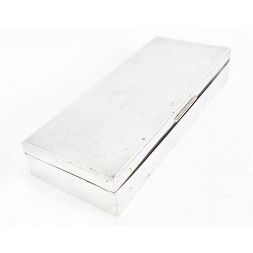 373 - An Elizabeth II silver cigarette box by Elkington & Co, Birmingham 1964, the lid with engine turned ... 