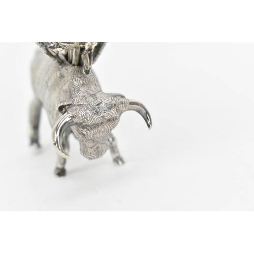 376 - A Continental silver novelty cocktail stick holder modelled as a Toro bull, with sticks shaped as sw... 