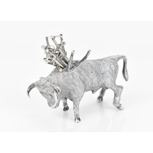 376 - A Continental silver novelty cocktail stick holder modelled as a Toro bull, with sticks shaped as sw... 