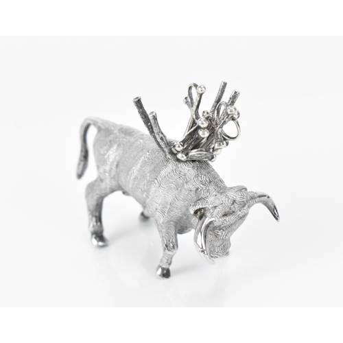 376 - A Continental silver novelty cocktail stick holder modelled as a Toro bull, with sticks shaped as sw... 