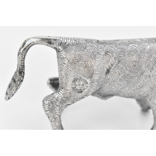 376 - A Continental silver novelty cocktail stick holder modelled as a Toro bull, with sticks shaped as sw... 