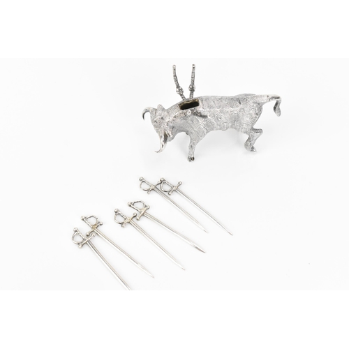 376 - A Continental silver novelty cocktail stick holder modelled as a Toro bull, with sticks shaped as sw... 