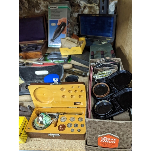 346 - A miscellaneous lot of tools, camera accessories, geometry sets, eye lens and other items to include... 