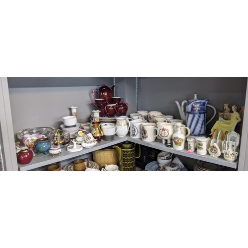 200 - A mixed lot to include ceramic and glassware, commemorative mugs, a Carltonware coffee set, a part s... 