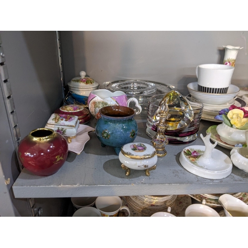 200 - A mixed lot to include ceramic and glassware, commemorative mugs, a Carltonware coffee set, a part s... 