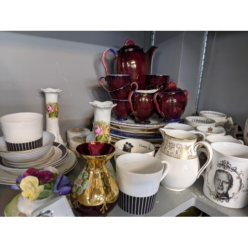 200 - A mixed lot to include ceramic and glassware, commemorative mugs, a Carltonware coffee set, a part s... 