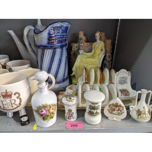 200 - A mixed lot to include ceramic and glassware, commemorative mugs, a Carltonware coffee set, a part s... 