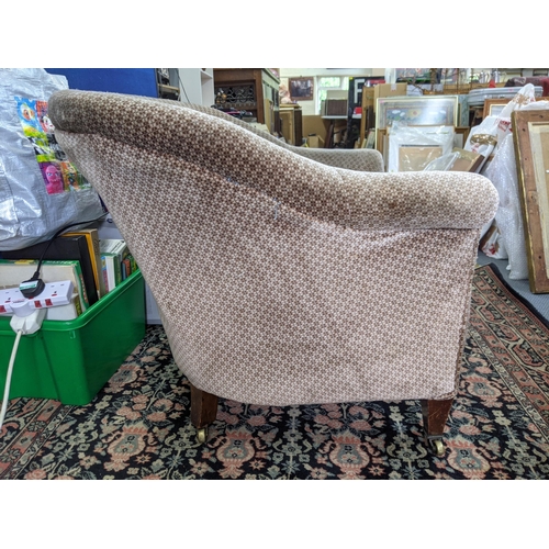 275 - An early 20th century upholstered tub chair on mahogany legs Location:RAF