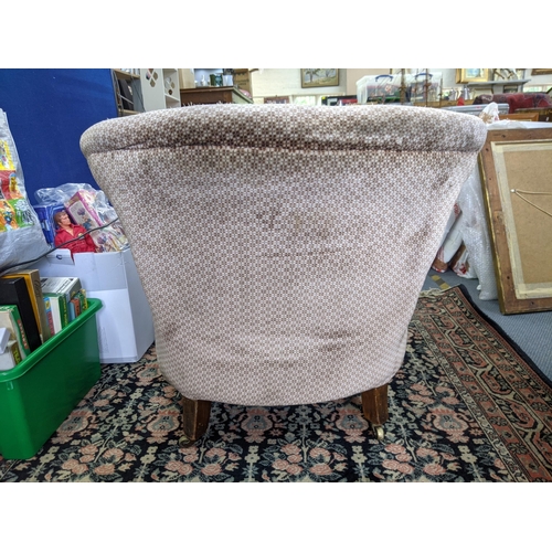 275 - An early 20th century upholstered tub chair on mahogany legs Location:RAF