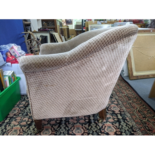 275 - An early 20th century upholstered tub chair on mahogany legs Location:RAF