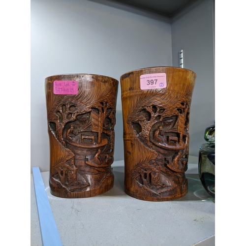 397 - A pair of late 19th/early 20th century Chinese carved bamboo brush pots
Location: 10.1