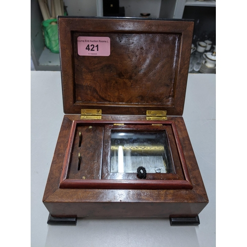 421 - A 20th century burr walnut musical box the lid inlaid with a bird
Location: P