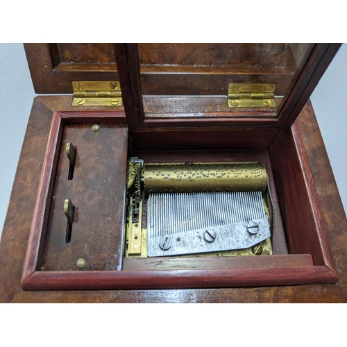 421 - A 20th century burr walnut musical box the lid inlaid with a bird
Location: P