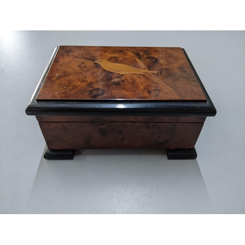 421 - A 20th century burr walnut musical box the lid inlaid with a bird
Location: P