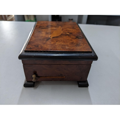 421 - A 20th century burr walnut musical box the lid inlaid with a bird
Location: P