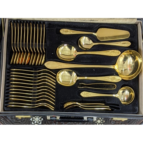 473 - A German Solingen Bestecke gold plated canteen of cutlery and flatware contained in a attaché style ... 