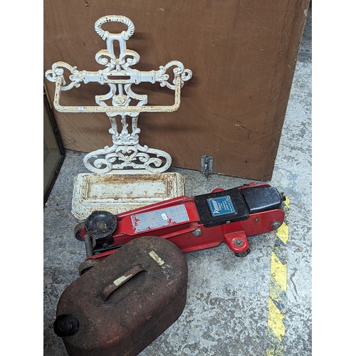 263 - A mixed lot to include a white painted cast iron stick stand, vintage petrol can and a Kamasa car ja... 