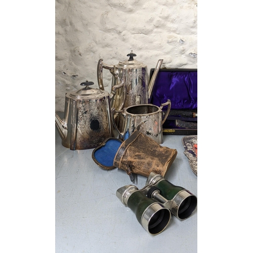 320 - A mixed lot of metalware to include a canteen of cutlery a silver plated tea and coffee pot, a cased... 