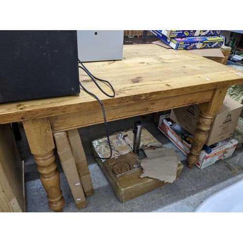 349 - A pine kitchen table with rectangular top with shaped corners, on turned legs 78cm x 135cm x 89.5cm ... 