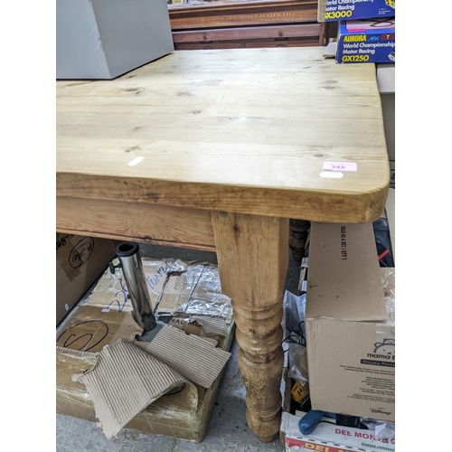 349 - A pine kitchen table with rectangular top with shaped corners, on turned legs 78cm x 135cm x 89.5cm ... 